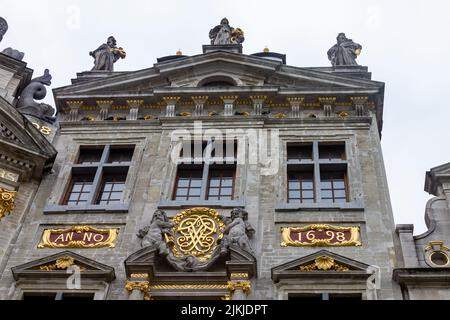 A low angle of sculptures on the roof of Guild historical buildings in Grand Place, Brussels Stock Photo