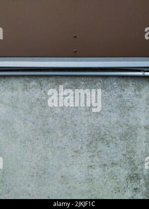 A concrete wall background texture with brown painted metal Stock Photo