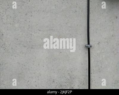 A concrete wall with a black wire background texture Stock Photo