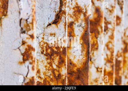 Rusty bridge railing texture background with cracked white paint Stock Photo
