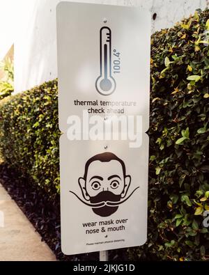 St. Petersburg, Florida January 14, 2021: Social distancing signage at entrance to Dali Museum in St. Petersburg Florida requiring mask wearing and te Stock Photo