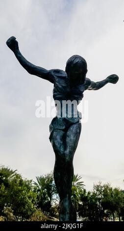 St. Petersburg, Florida January 14, 2021: Sculpture in avant garden of Christ of St. John of the Cross at Dali Museum against cloudy sky Stock Photo