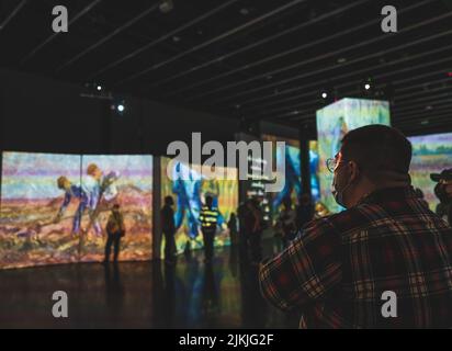 St. Petersburg, Florida January 14, 2021: People take in the immersive Van Gogh Alive Exhibit during its tenure at the Dali Museum Stock Photo