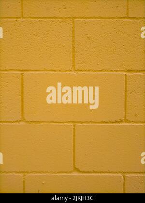 A yellow painted brick wall texture Stock Photo