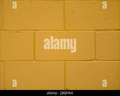 A yellow painted brick wall texture Stock Photo