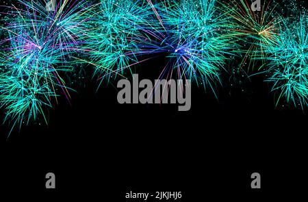 A colorful fireworks on a black isolated background Stock Photo