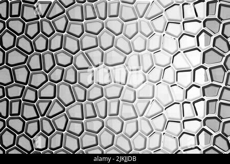 A gray, illuminated illustration of an irregular honeycomb created by a computer. Abstract texture Stock Photo