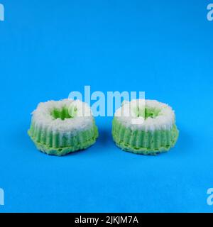 Putri Ayu cake isolated on a blue background, a traditional Indonesian cake that tastes sweet and soft Stock Photo