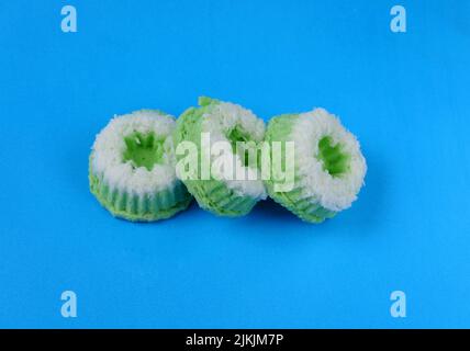 Putri Ayu cake isolated on a blue background, a traditional Indonesian cake that tastes sweet and soft Stock Photo