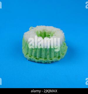 Putri Ayu cake isolated on a blue background, a traditional Indonesian cake that tastes sweet and soft Stock Photo