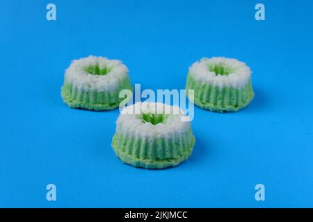 Putri Ayu cake isolated on a blue background, a traditional Indonesian cake that tastes sweet and soft Stock Photo