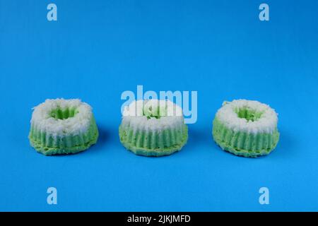 Putri Ayu cake isolated on a blue background, a traditional Indonesian cake that tastes sweet and soft Stock Photo