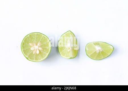lime with slices isolated on white background Stock Photo