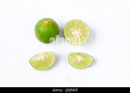 lime with slices isolated on white background Stock Photo