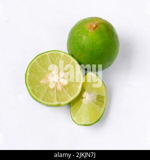 lime with slices isolated on white background Stock Photo