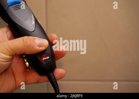 Hair trimmer charge and maintenance close up view Stock Photo