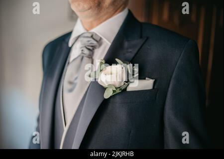 A closeup shot of the boutonniere of the groom Stock Photo