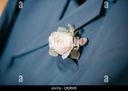 A closeup shot of the boutonniere of the groom Stock Photo