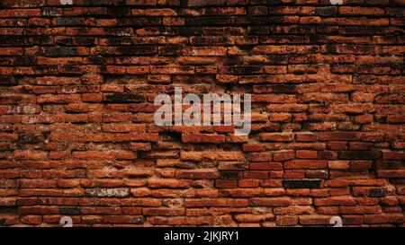 An old grungy red brick wall background Stock Photo