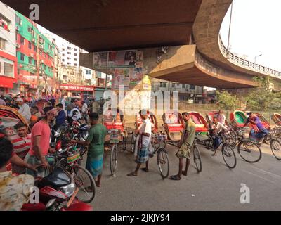 The daily life of bicycle rickshaw transport riders in the street of Dhaka, Bangladesh Stock Photo