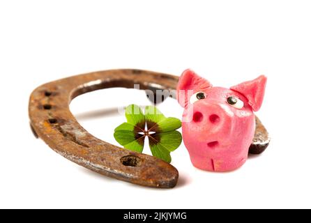 horseshoe with green shamrock sign for luck for st patricks day isolated on a white background Stock Photo