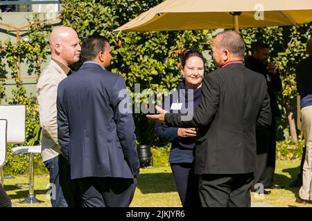 The delegates having conversation outdoors during business conference in Johannesburg Stock Photo