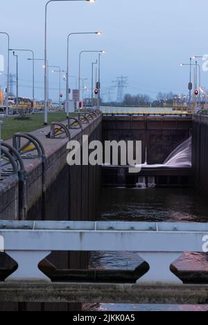 A vertical shot of one of the biggest sluice gates in the Netherlands located in Maasbracht Stock Photo