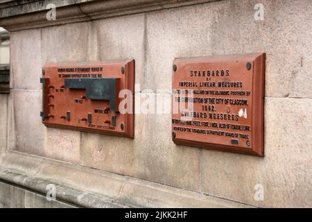 City Chambers, George Square,Glasgow., Scotland UK. Glasgow Standard Measures on wall of city chambers. An usual feature on the building. Sign reads standard of Imperial Linear Measure, Place on the wall and a joining footpath by corporation of City of Glasgow 1882 Stock Photo