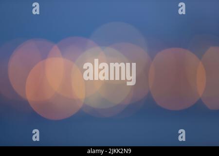 A Defocused, blurred bokeh and abstract blurry of red taillights moving with purple background Stock Photo