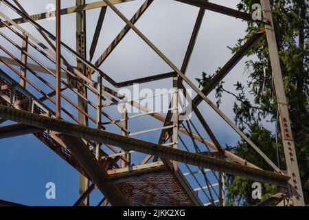 A Rusted iron railing and steps on an old forest service fire tower Stock Photo