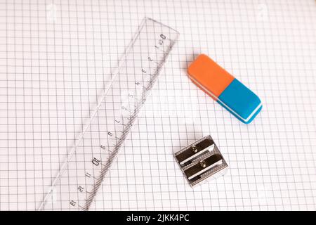 school equipment ruler, eraser with checkered paper Stock Photo