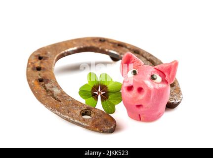 horseshoe with green shamrock sign for luck for st patricks day isolated on a white background Stock Photo