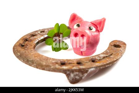 horseshoe with green shamrock sign for luck for st patricks day isolated on a white background Stock Photo