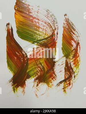 A closeup shot of a paint colorful brush strokes on white wall Stock Photo
