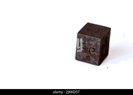 Iron cube with element name Fe on it on white background Stock Photo