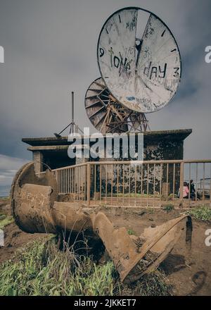 A clock on Stairway to Heaven in Oahu, Hawaii Stock Photo