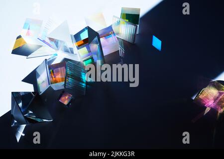 Geometric figures prisms with light diffraction of spectrum colors and reflection with trendy light Stock Photo