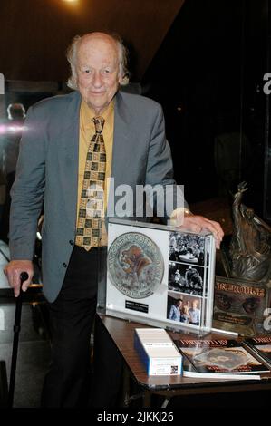 A vertical shot of the father of stop motion animation Ray Harryhausen receiving the Cinerouge award for lifetime achievement Stock Photo
