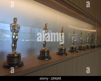 A row of Oscars on a shelf at the Academy of Motion Picture Arts and Sciences in Hollywood (Los Angeles), CA Stock Photo