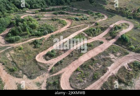 Offroad track for motocross on bright sunny day aerial view Stock Photo