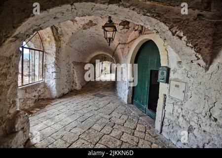 A narrow hallway in the medieval village of Pietramelara in the province of Caserta, Italy. Stock Photo
