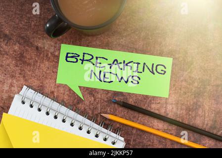 Text sign showing Breaking News. Word Written on Special Report Announcement Happening Current Issue Flashnews Speech Bubble With Spiral Book And Stock Photo