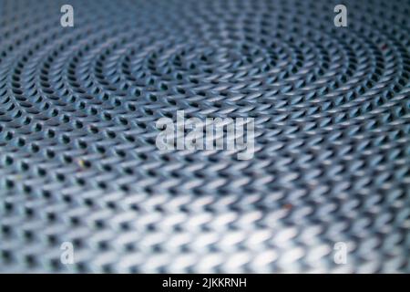 A closeup of a textured wavy silver steel surface Stock Photo