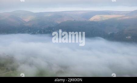 A closeup of fog covering Church Stretton, Shropshire Stock Photo