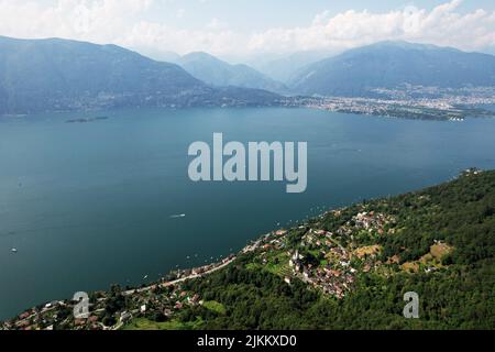 A bird's eye view of Sant Abbondio over Lago Maggiore lake and Locarno mountains in Ticino,Switzerland Stock Photo