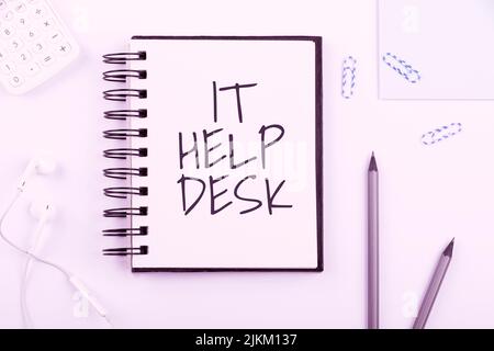 Sign displaying It Help Desk. Concept meaning Online support assistance helping showing with technology Notebook With New Message On Desk With Pens Stock Photo
