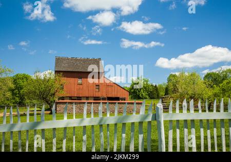 Daniel Boone Homestead red barn and fence, Berks County, Pennsylvania, USA PA Images US old vintage farming frontiersman Stock Photo