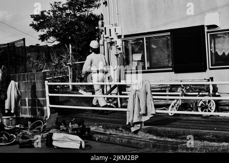 A grayscale shot of Japanese construction workers in Ise City, Mie prefecture, Japan Stock Photo