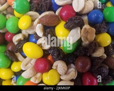 Colorful mixed candies and nuts and raisins in bulk Stock Photo