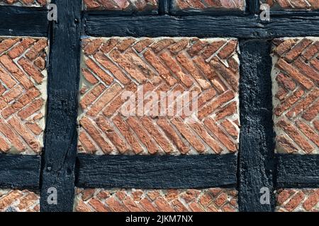 Tudor brick nogging in herringbone pattern - England, UK Stock Photo